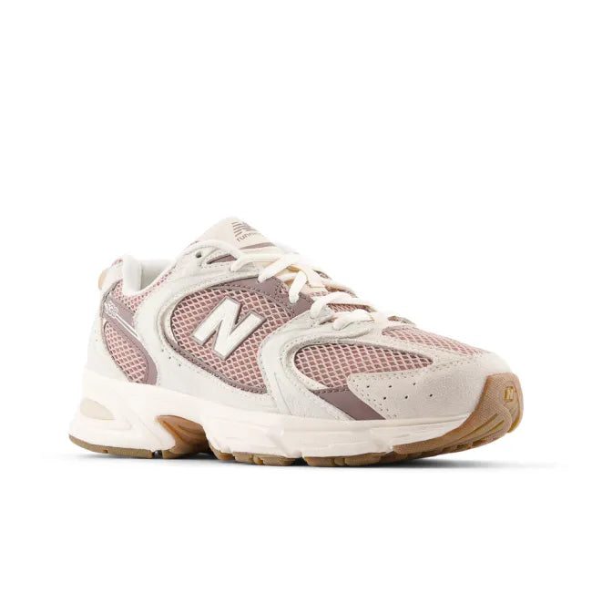 Front angled view of New Balance Unisex 530 Lifestyle Shoe in Bisque Earth Shadow Pink