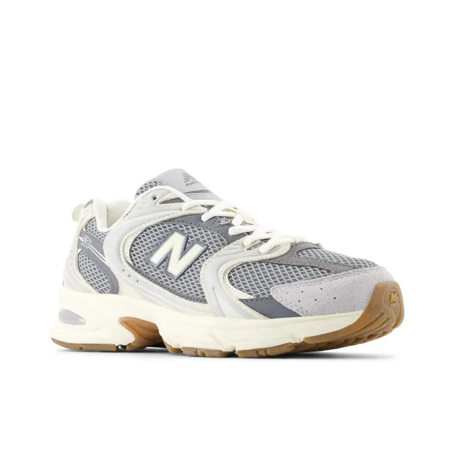 Front angled view of New Balance Unisex 530 Lifestyle Shoe in raincloud castlerock grey