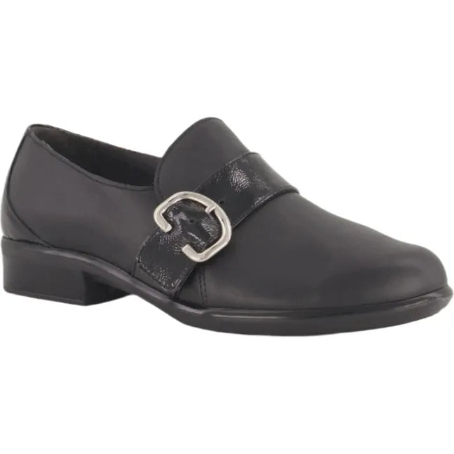 Lateral side angled view the Naot Women's Viscol shoe in black leather, featuring a sleek design with a chic buckle accent, 1.5-inch durable polyurethane heeled sole, and removable cork and latex footbed, suitable for both professional and casual settings.