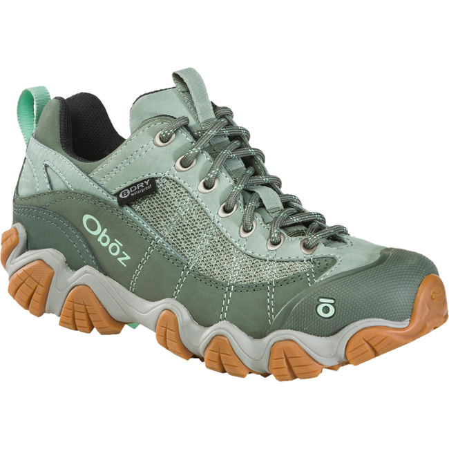Front angled view of Women&#39;s Oboz Firebrand II Low Hiking Shoe in pale moss green with tan tread
