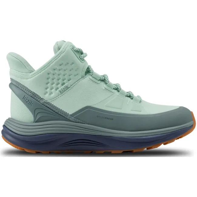Lateral side of Women’s Kizik London AT Mid Waterproof Boot in mint green with hands free step in