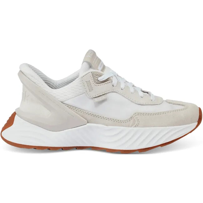 Lateral side of Womens Kizik Monaco Sneaker in white &amp; beige, thick sole, and easy HandsFree Step-In