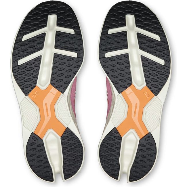 Soles of Women's On Running Cloudeclipse Running Shoes in Tangerine and Ivory with black tread