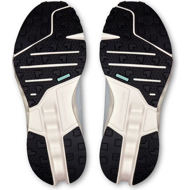 Soles of Womens On Running Cloudsurfer Trail Running Shoes in Arctic blue and Ivory with black tread