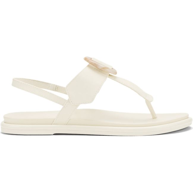 Lateral side of Women's Olukai La'i T-Bar Sandal in white sand with backstrap