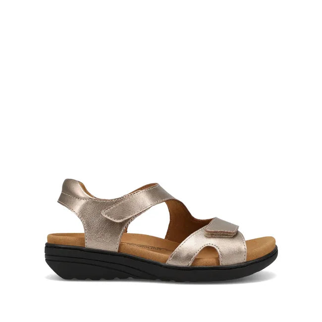 Lateral side of Women's Taos Serene Sandal in Champagne leather with velcro straps