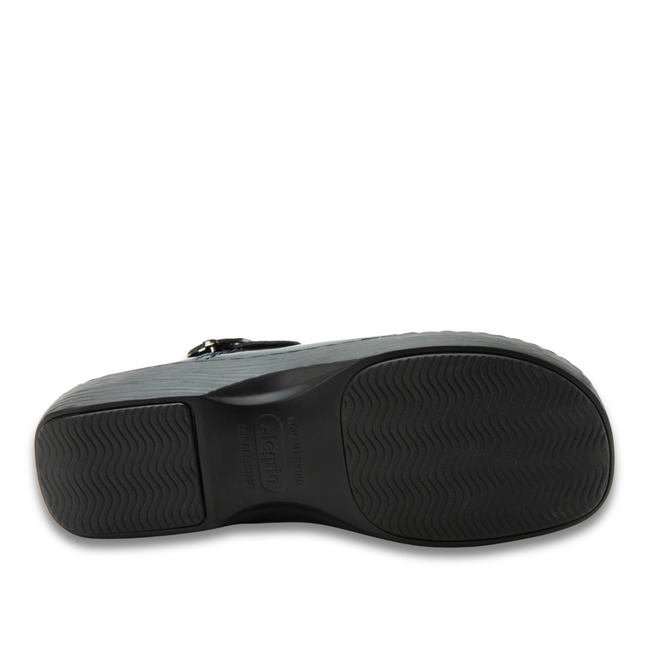 Black slip resistant sole of Alegria Women's Olie Clogs in Space Invaders Navy