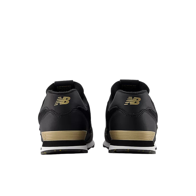 Heels of New Balance Kids' 574 Lifestyle Shoe (Toddler/Little Kid) in Black with Gold