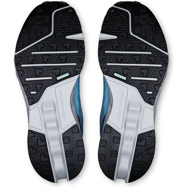 Soles of Men's On Running Cloudsurfer Trail Running Shoes in Niagara Glacier blue with black tread