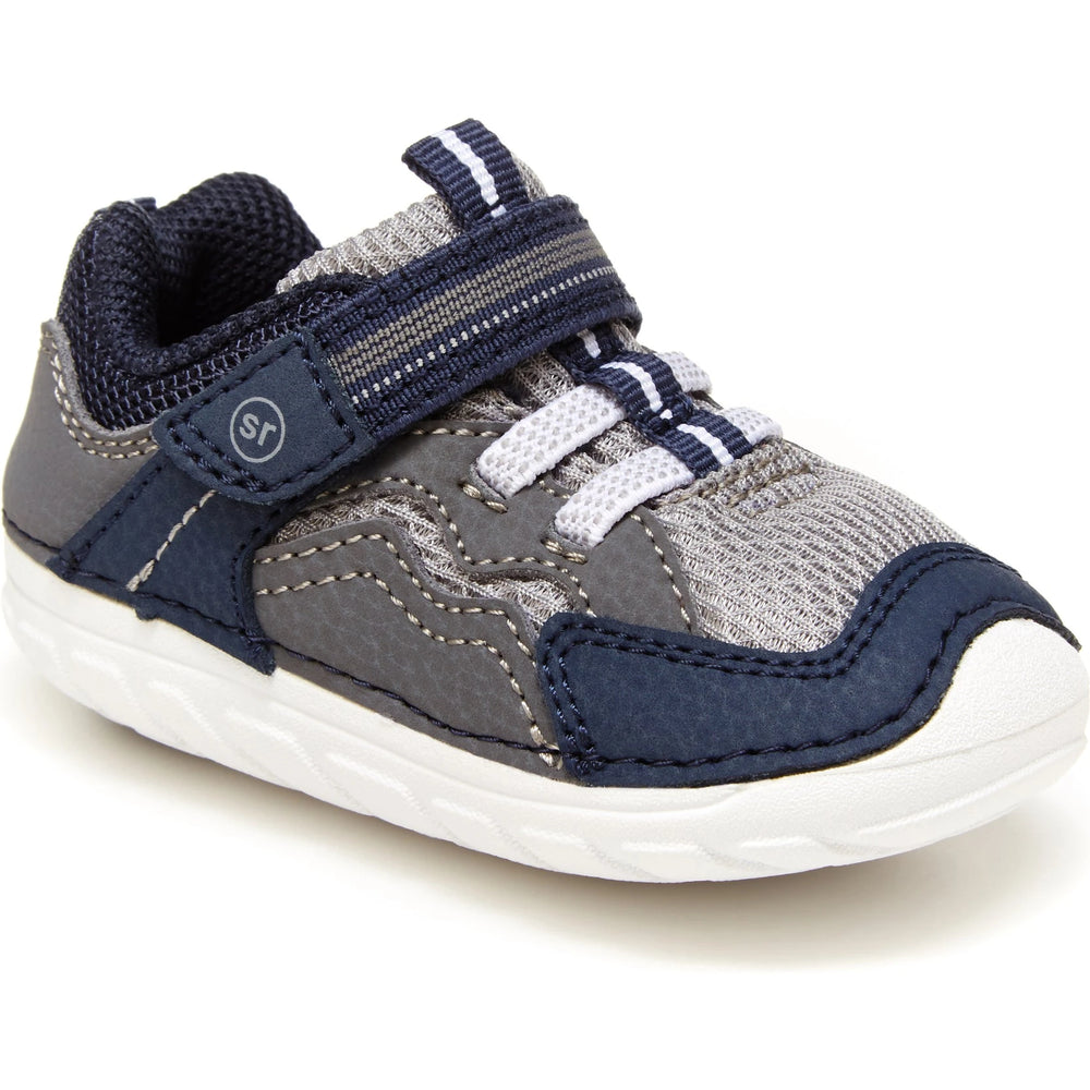 Front angled view of Stride Rite Kids' Soft Motion Kylo Sneaker in Navy/Grey