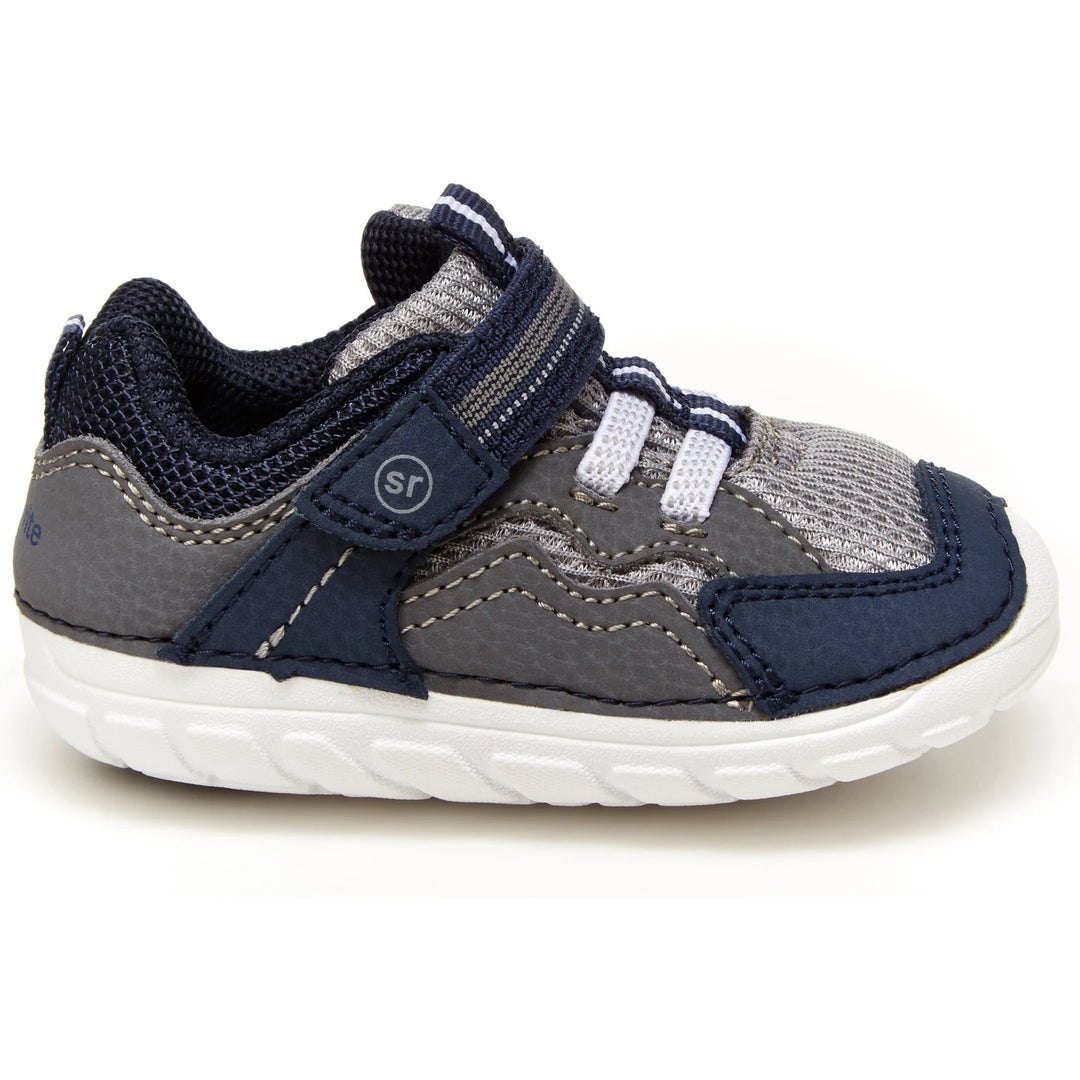 Side of Stride Rite Kids' Soft Motion Kylo Sneaker in Navy/Grey