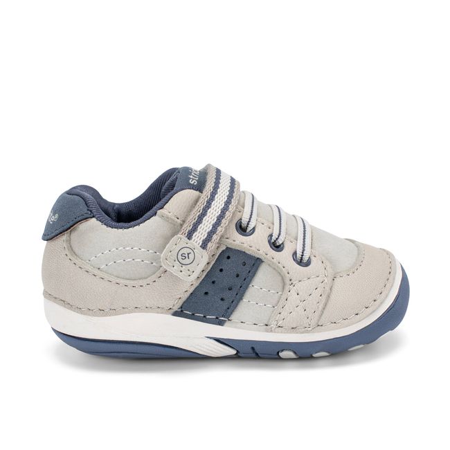 Right side profile of the Stride Rite Artie in stone grey leather with a navy outsole