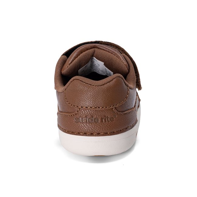 Rear heel view of the Stride Rite Alfredo Mini in warm brown leather with a cream sole