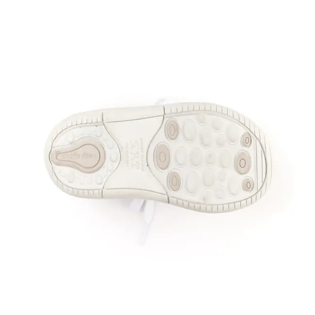 Outsole of the Stride Rite Elliot first walker shoe in cream white showing the traction pattern