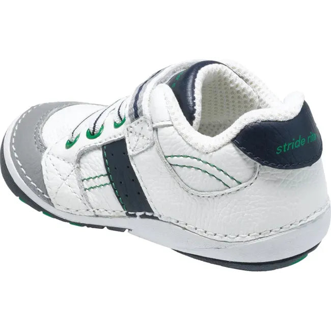 Rear heel view of the Stride Rite Artie in cream white with deep navy heel panel