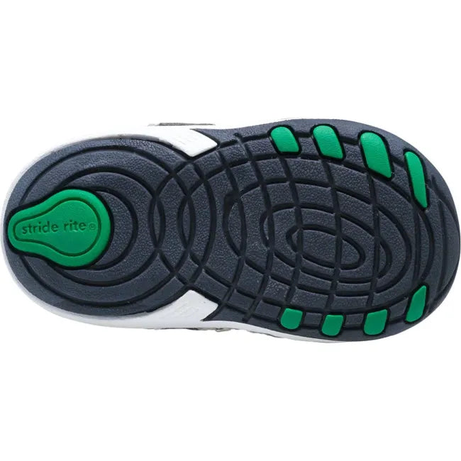 Outsole of the Stride Rite Artie in deep navy and green showing the traction pattern