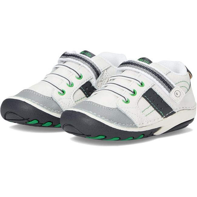 Pair of Stride Rite Artie sneakers in cream white with grey toe caps and green accents
