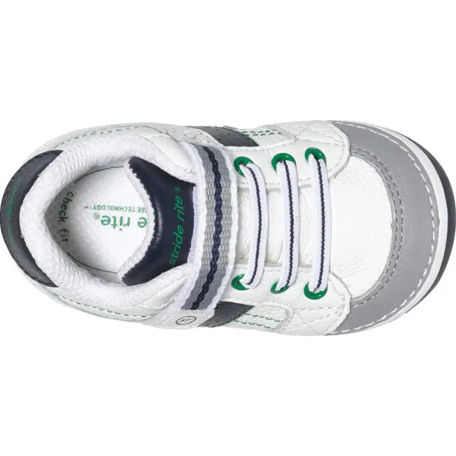 Top down view of the Stride Rite Artie in cream white with navy strap and green laces