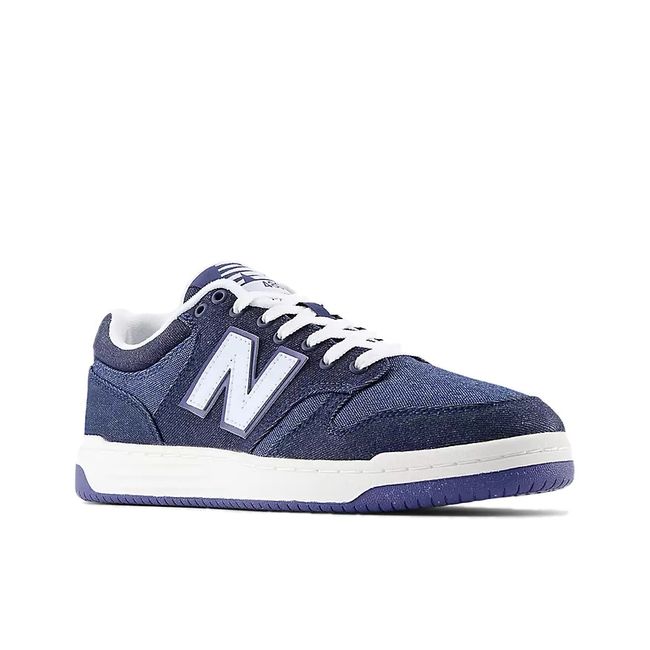 Front angled view of Unisex New Balance 480 Sneaker in Navy Blue Denim