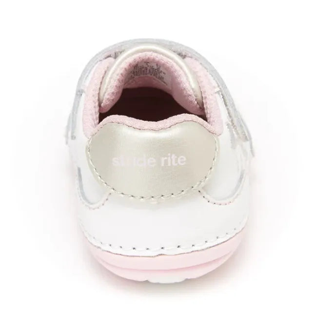 Rear heel view of the Stride Rite Adalyn in cream white with pearl silver heel patch