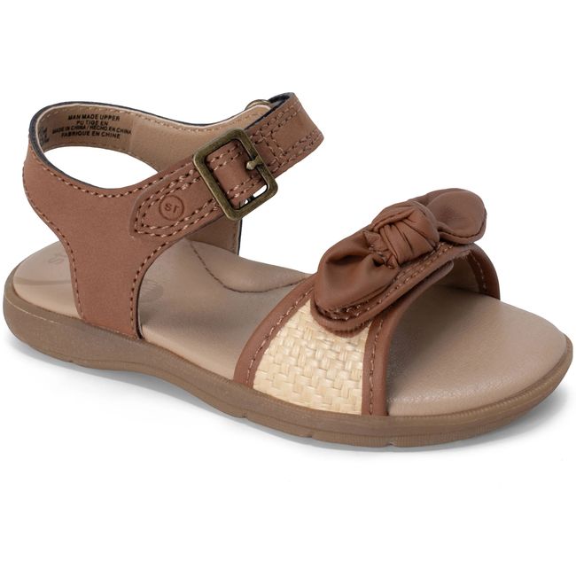 Stride Rite Whitney sandal in warm tan leather with a woven raffia strap, angled view