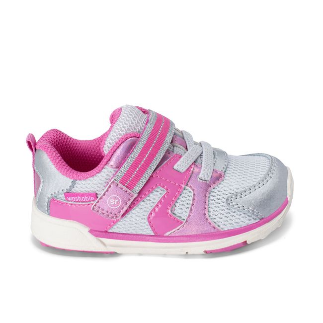 Right side profile of the Stride Rite Velocity in metallic pink with a white sole