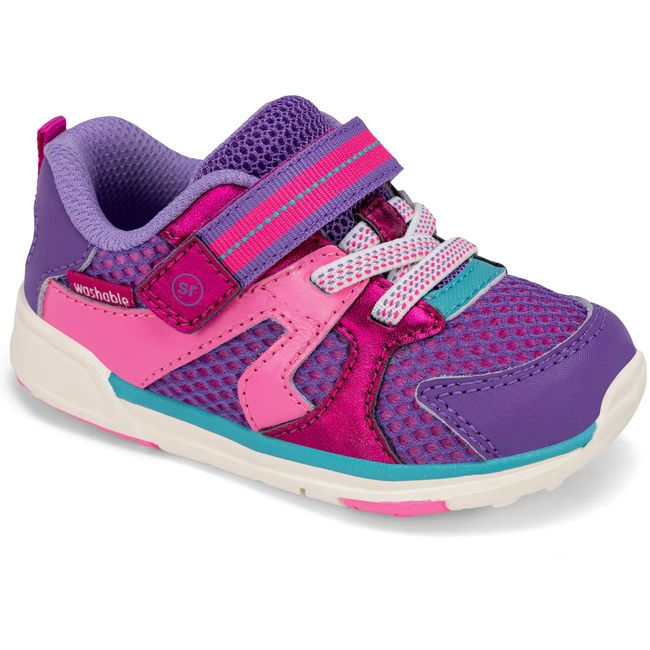 Stride Rite Velocity sneaker in blush pink with rainbow multi accents, angled view