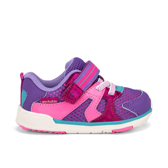 Right side profile of the Stride Rite Velocity in blush pink with a white sole