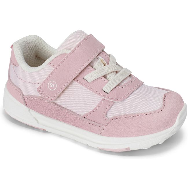 Stride Rite Juniper sneaker in blush pink and cream with a white sole, angled view