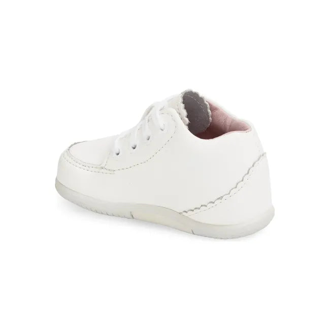 Rear heel view of the Stride Rite Emilia in cream white leather with blush pink lining