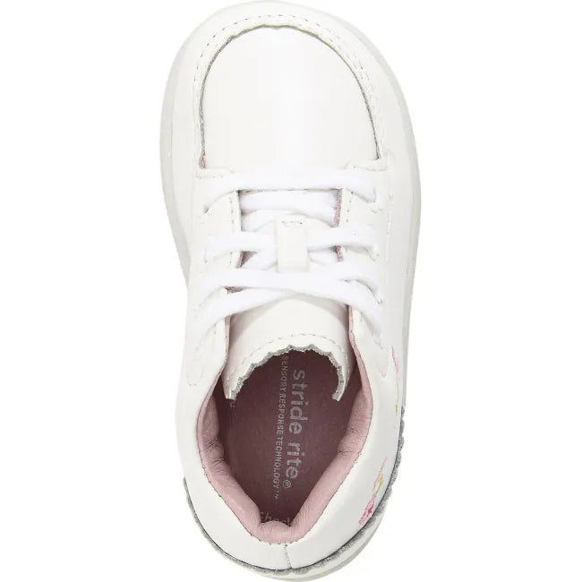 Top down view of the Stride Rite Emilia in cream white leather with blush pink lining