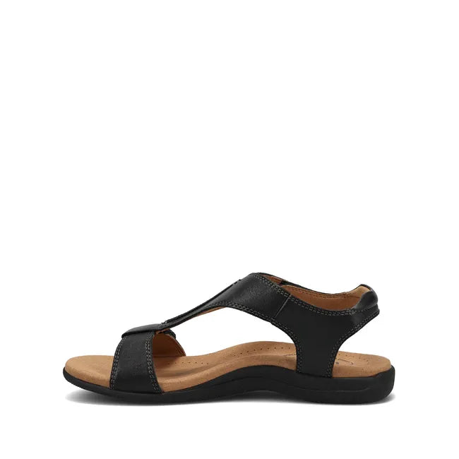 Medial side of Women's Taos The Show Sandal in black leather with velcro straps