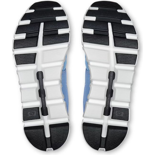 Soles of Womens On Running Cloud 6 Running Shoes in Chambray White with hollow cloud pods for impact