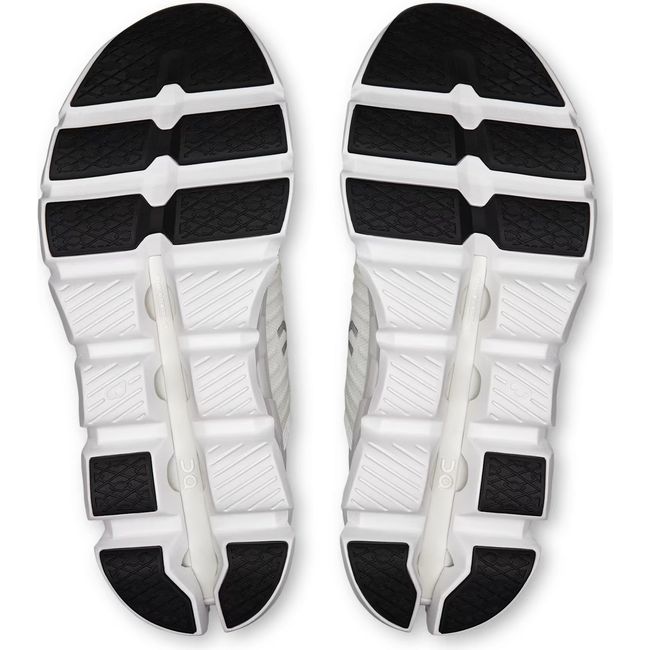 Soles of Women's On Running Cloudswift 4 Running Shoes in White White with hollow cloud pods