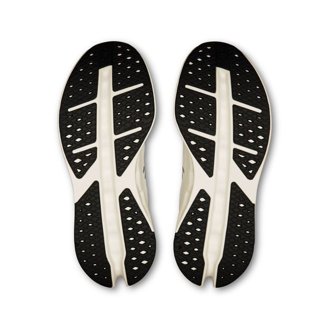 Sole of Women's On Running Cloudsurfer Max Cushioned Running Shoes in All White with black tread