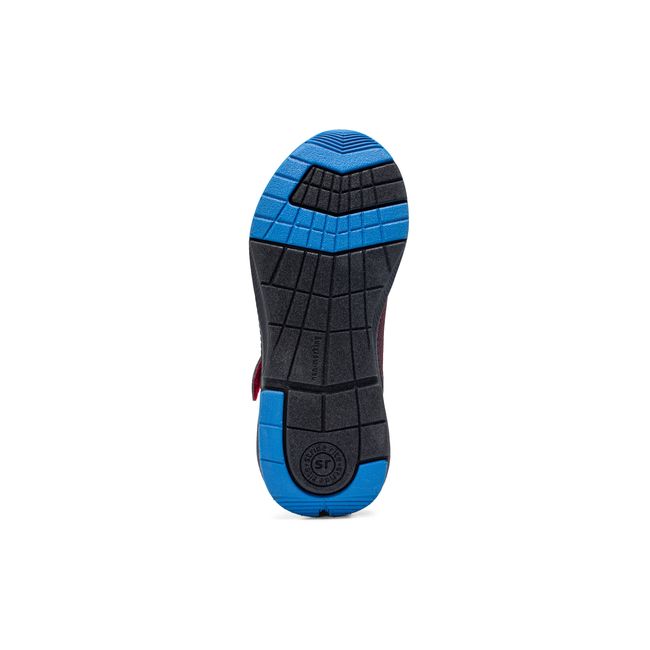 Outsole of the Stride Rite Equilibrium in black and red showing the traction pattern