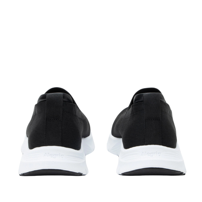Heels of Women&#39;s Alegria Waze slip on shoes in black knit upper and white soles