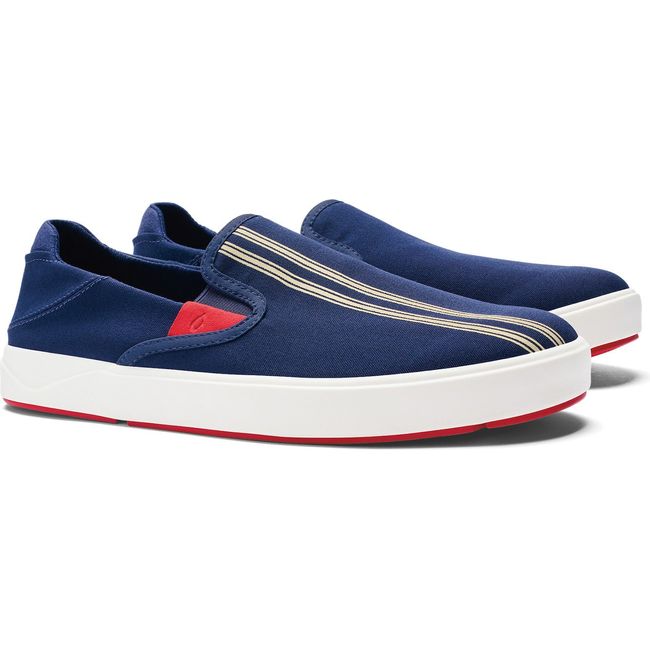 Pair of Men's Olukai Laeahi Sneaker. Navy. White sole. Red accents. Two white stripes on upper