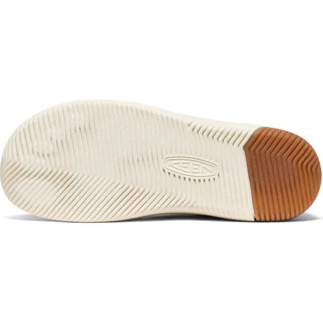 White sole of KEEN Women's Slip On KNX T-Toe Sneaker in Chipmunk Birch Tan