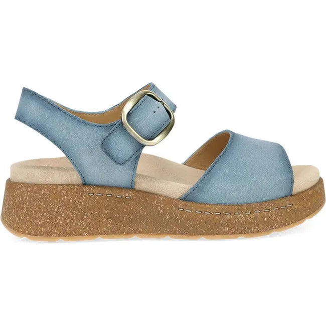 Lateral side of Women's Dansko Bianca Sandal in blue suede with cork platform sole