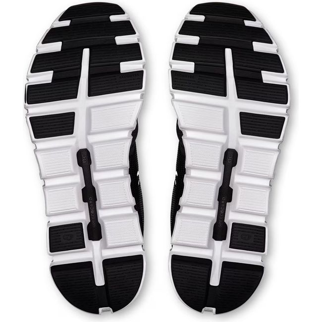 Soles of On Running Women's Cloud 6 Running Shoes in black and white