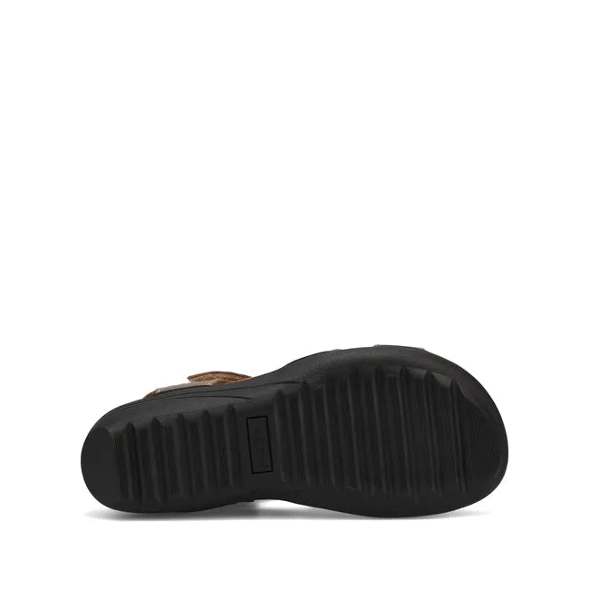 Black sole of Women's Taos Serene Sandal in Champagne leather upper