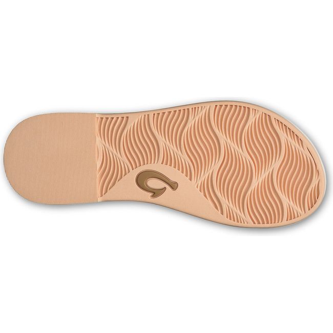 Sole of women's Olukai Lai T Bar sandal with tan tread