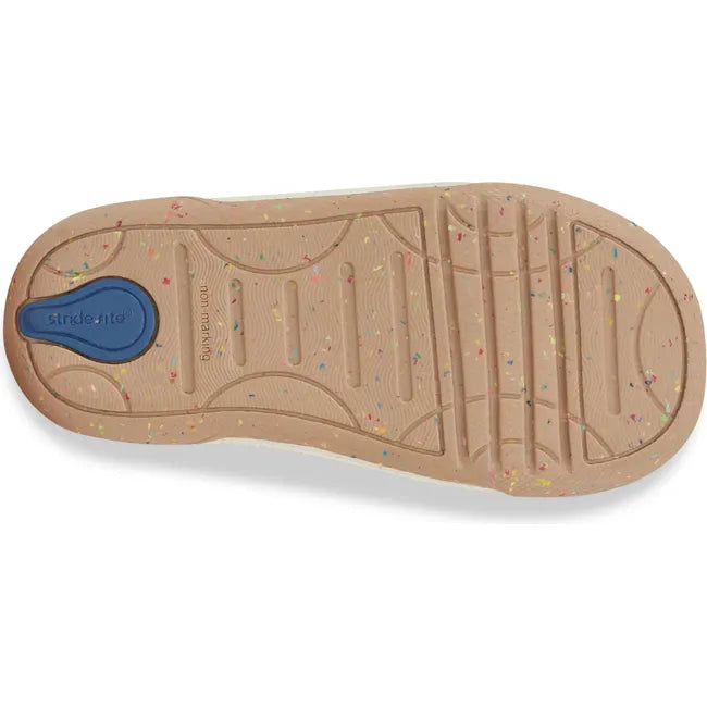 Sole of Kids Stride Rite Fern Sneaker in camel tan color with a blue accent