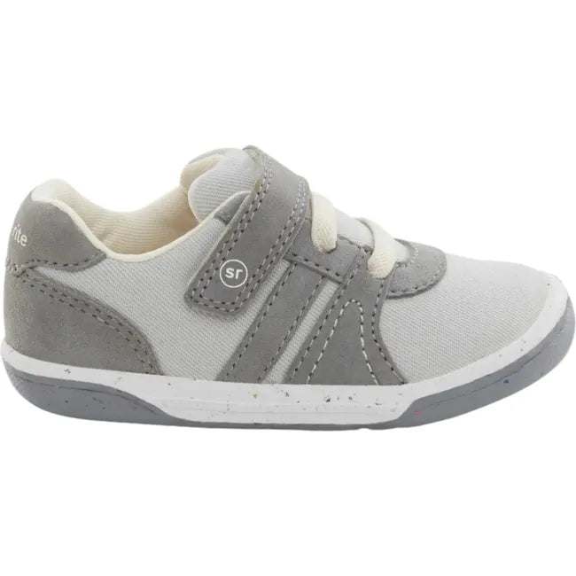 Lateral side of Kids Stride Rite Fern Sneaker in gray and light gray with a velcro strap