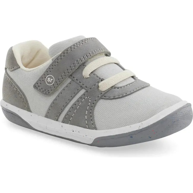 Front angled view of Kids Stride Rite Fern Sneaker in gray and light gray with a velcro strap