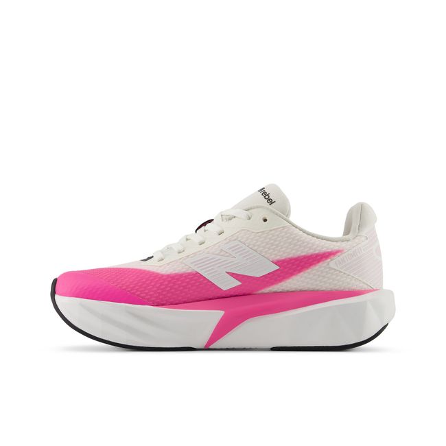 Medial profile of the New Balance FuelCell in cream with hot pink detailing
