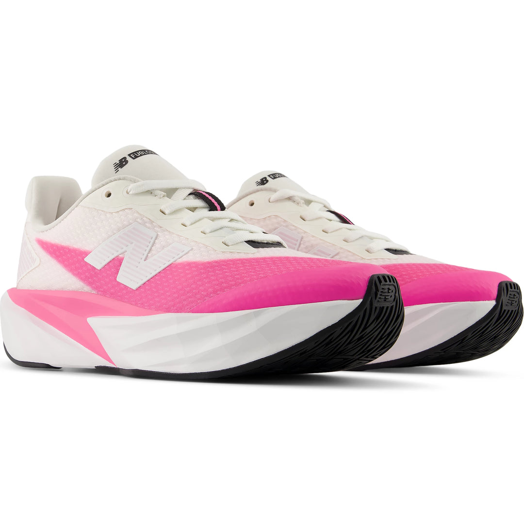 Pair of New Balance Kids' FuelCell Rebel running shoes in Pink Heat/White