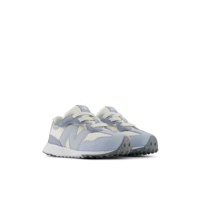 Pair of New Balance baby 327 sneakers in pale blue and cream