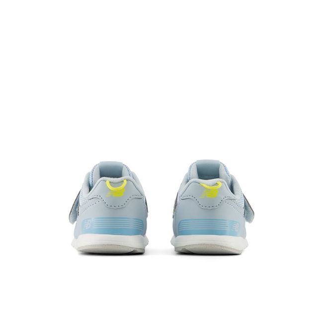 New Balance 574 New-B kids sneaker in bright blue, heel view.